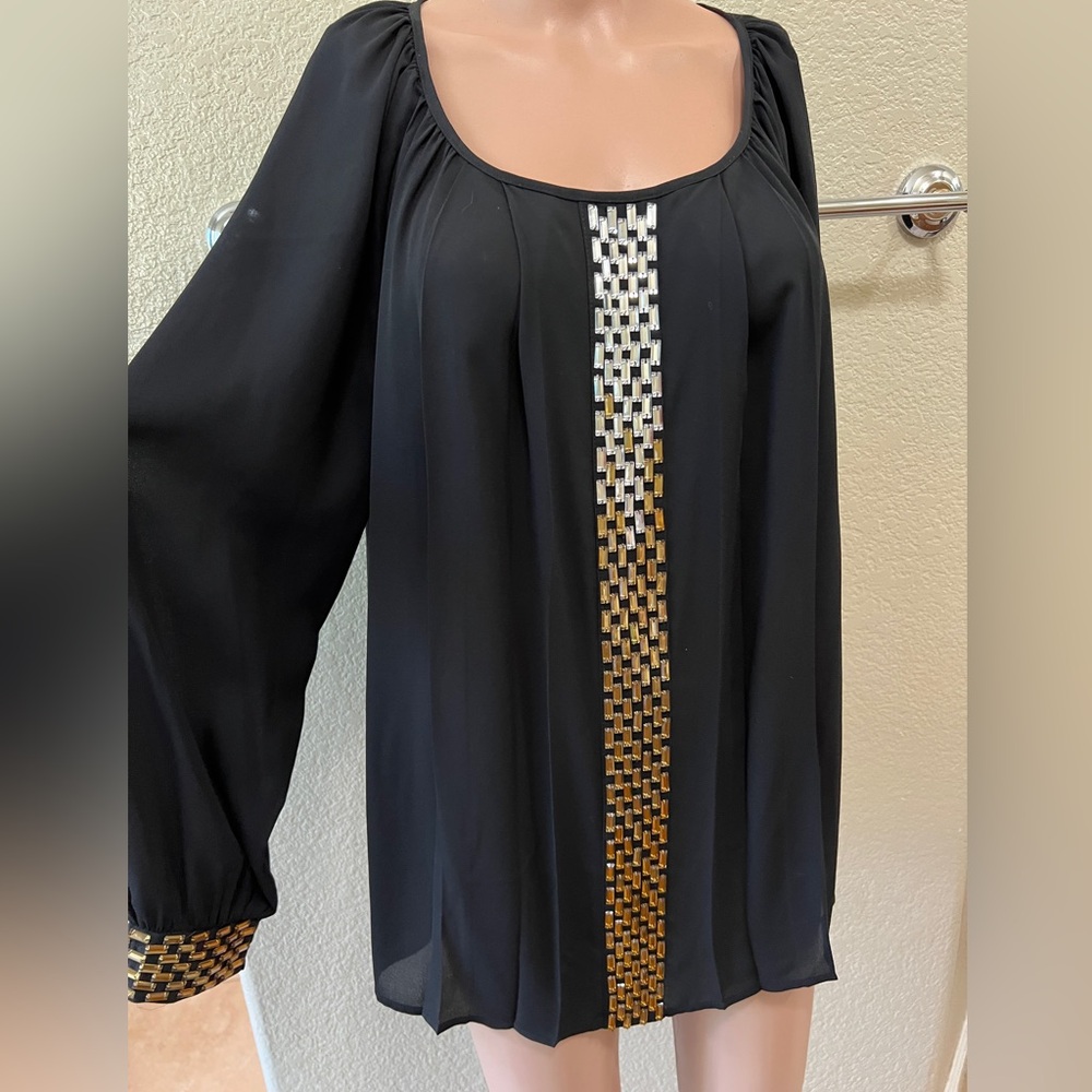 Women’s top/blouse in black color, long sleeves, dress up.